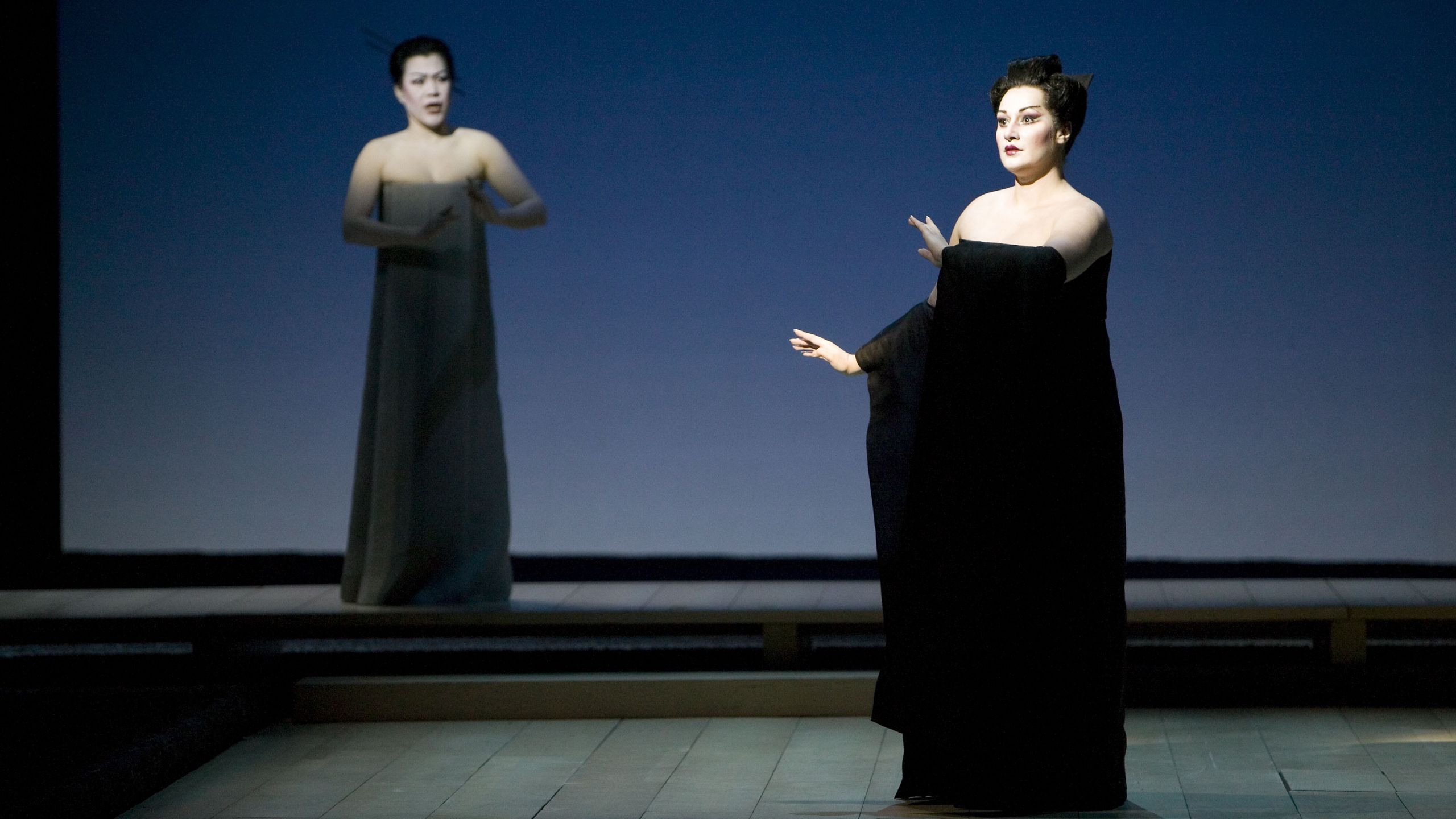 Two people in black dresses