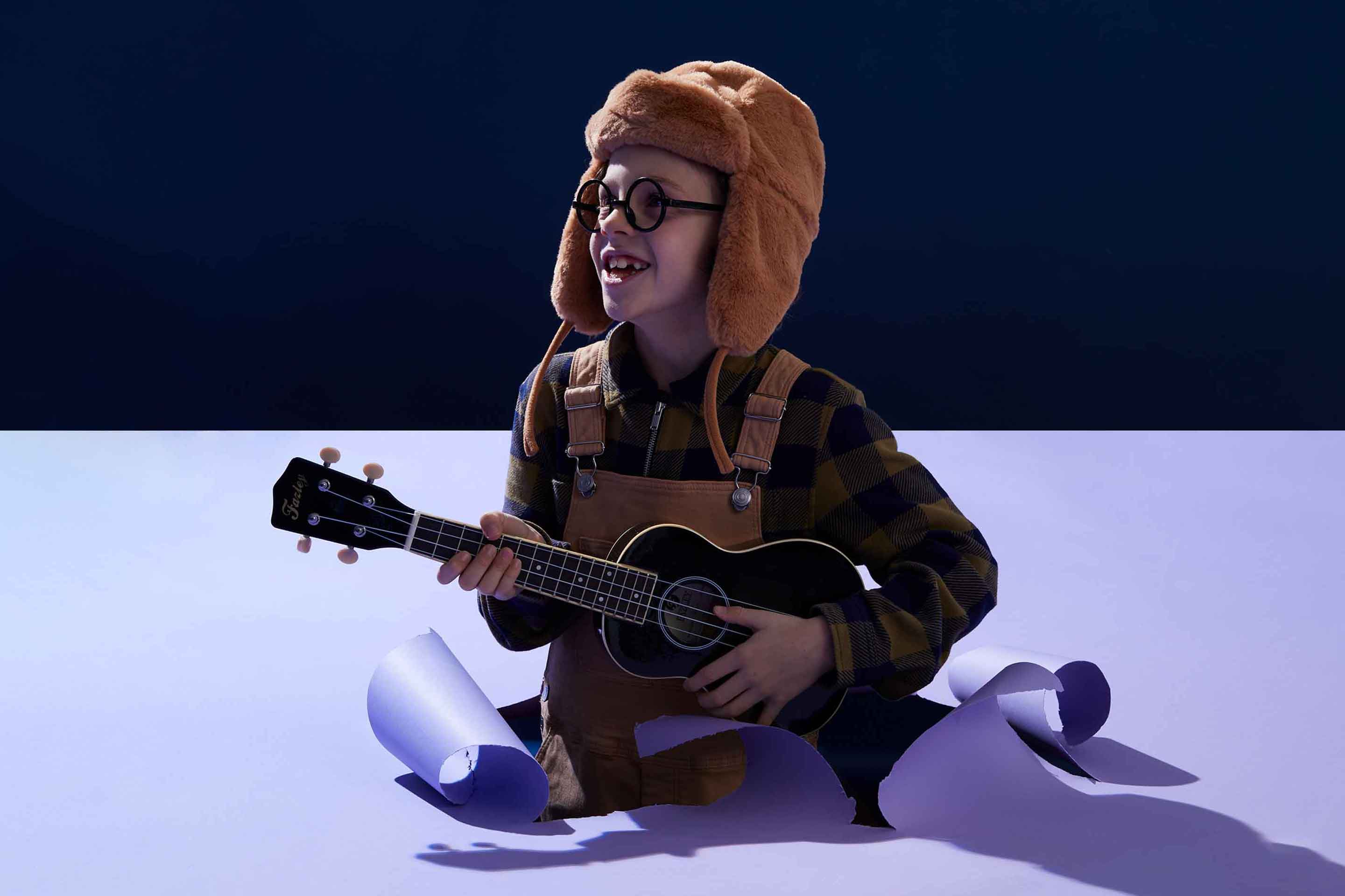 A song for the moon; boy with ukulele