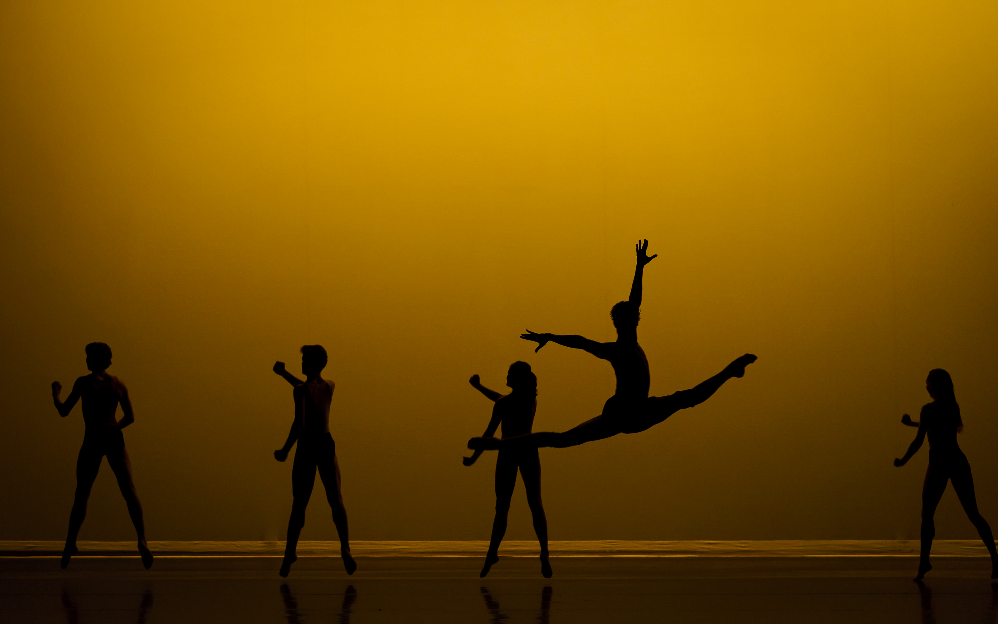 Five dancers with gold coloured background