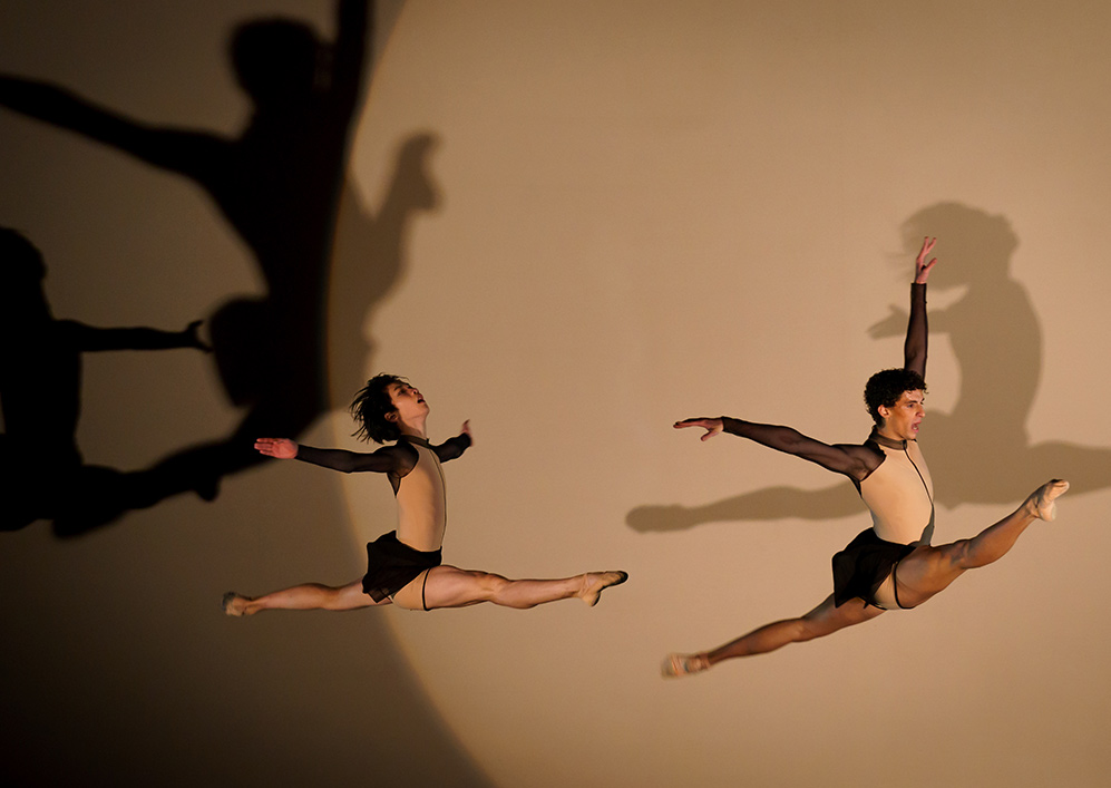 two young dancers in splits